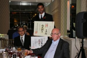 Johnpaul Williams receiving Seiwakai and JKF Gojukai 5th Dan Certificates from Fujiwara Seiichi and Leo Lipinski.